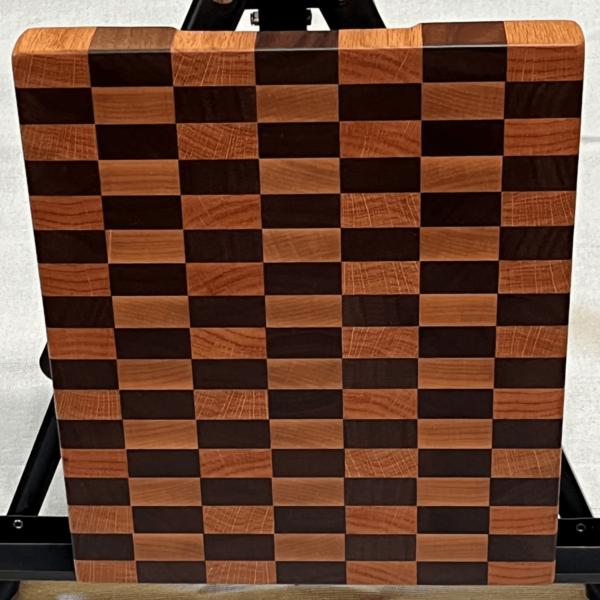 solid wood cutting board in a black and brown checkerboard style