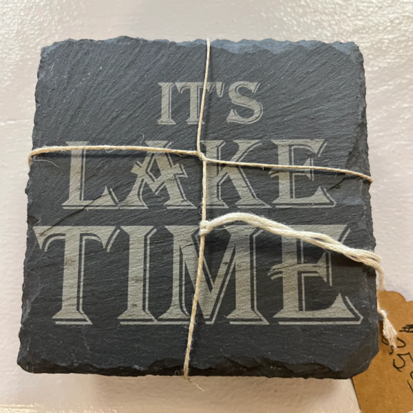 set of slate drink coasters with the wording it's like time printed on the front