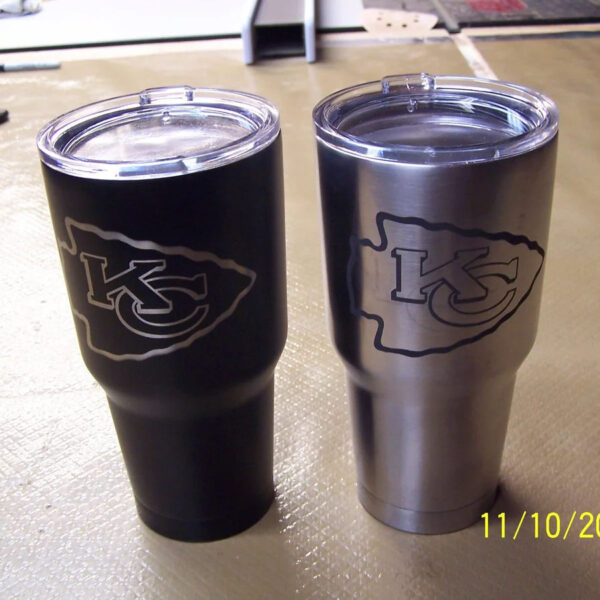 two stainless steel tumblers with the kansas city chiefs logo on the front